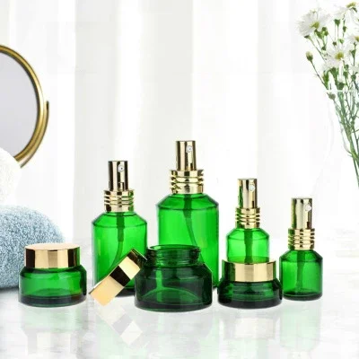 Popular, recargable, forma redonda, embalaje cosmético para el cuidado de la piel, tarros cosméticos de vidrio de color mate transparente y juego de botellas de maquillaje