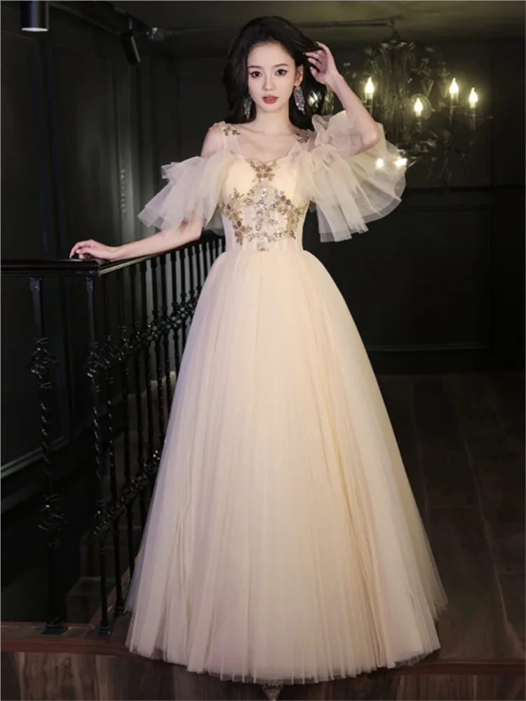 

Champagne-toned suspenders will be the birthday host performing a tulle dress