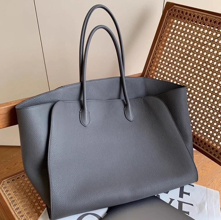 

Gray genuine leather large capacity tote bag women's 2025 new light luxury niche high-end hand-held commuter bag
