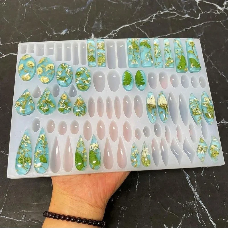 قالب سيليكون على شكل أقراط مع 41 شكلًا، قالب راتينج مستطيل على شكل دمعة متدلية بالأشعة فوق البنفسجية، قالب صب لصنع المجوهرات كابوشون