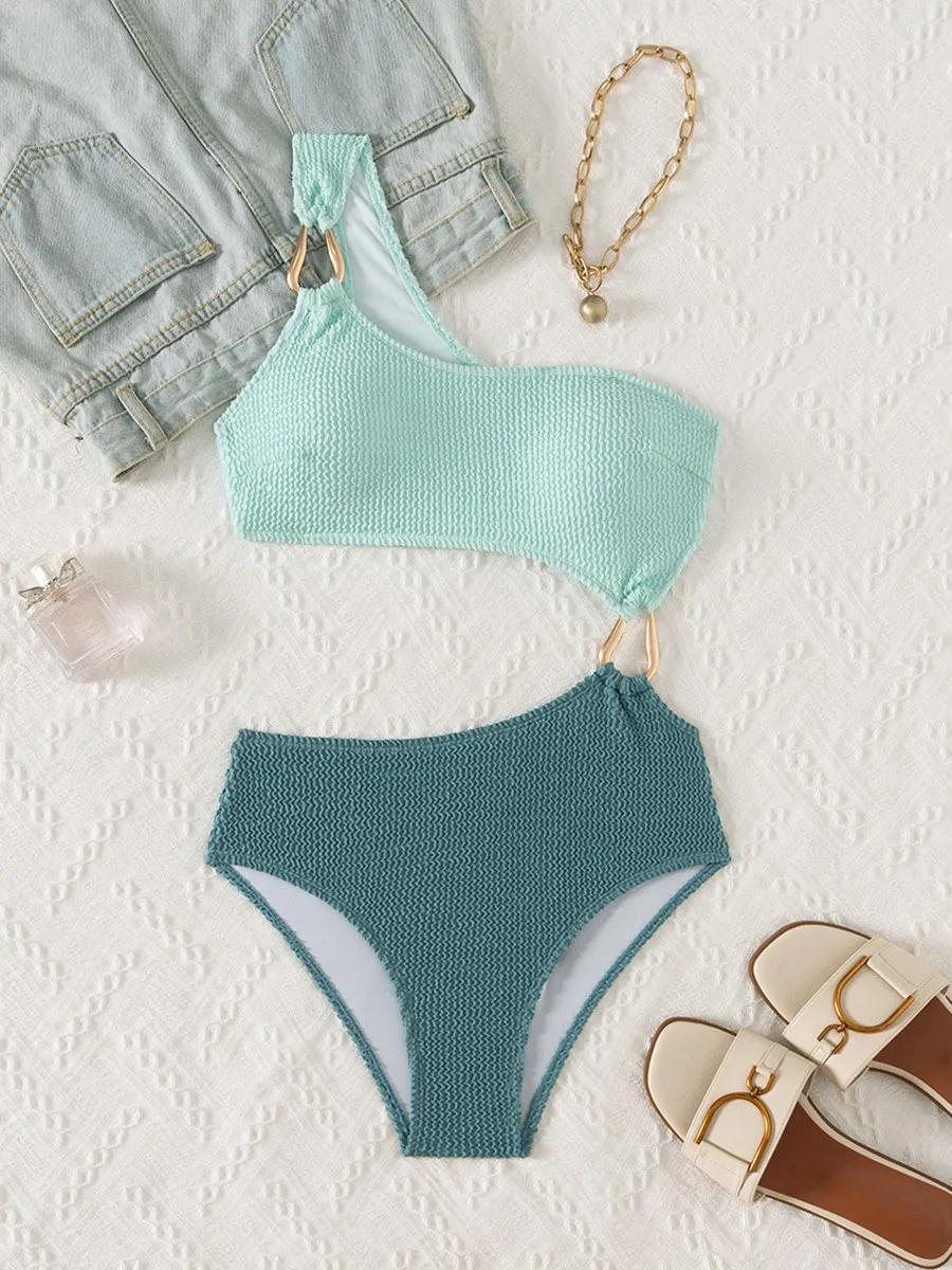 2025 Traje de baño de una pieza de un solo hombro con anillo de metal Conjunto de traje de baño de bikini de retazos de color contrastante con almohadilla en el pecho