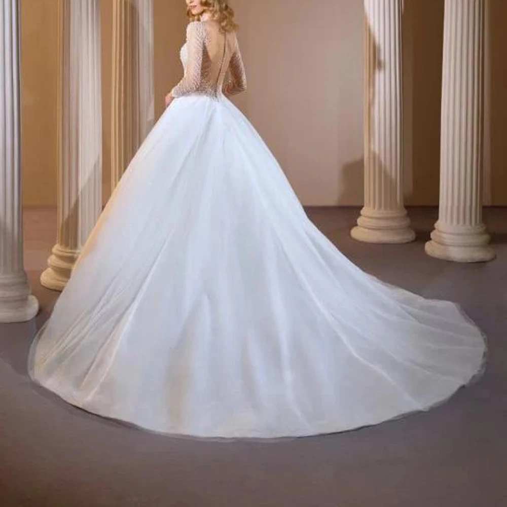 カスタムメイドのビーズ装飾が施されたウェディングドレス、ロングスリーブ、キラキラ輝くチュールのボールガウン、花嫁用、ボタンバック、ローブ・ド・マリアージュ