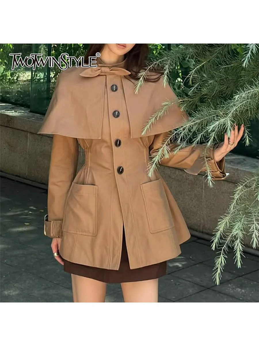 TWOTWINSTYLE Solid Spliced Bowknot Temperament Trenchs for Women Stand Neck Long Sleeves Tunic Fashion Trench Female Clothes New