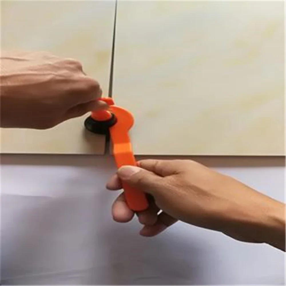 Localizzatore di clip per equalizzatore di piastrelle a forma di T apposto sul livellamento della carta con cucitura a sezione T a croce per piastrelle da pavimento