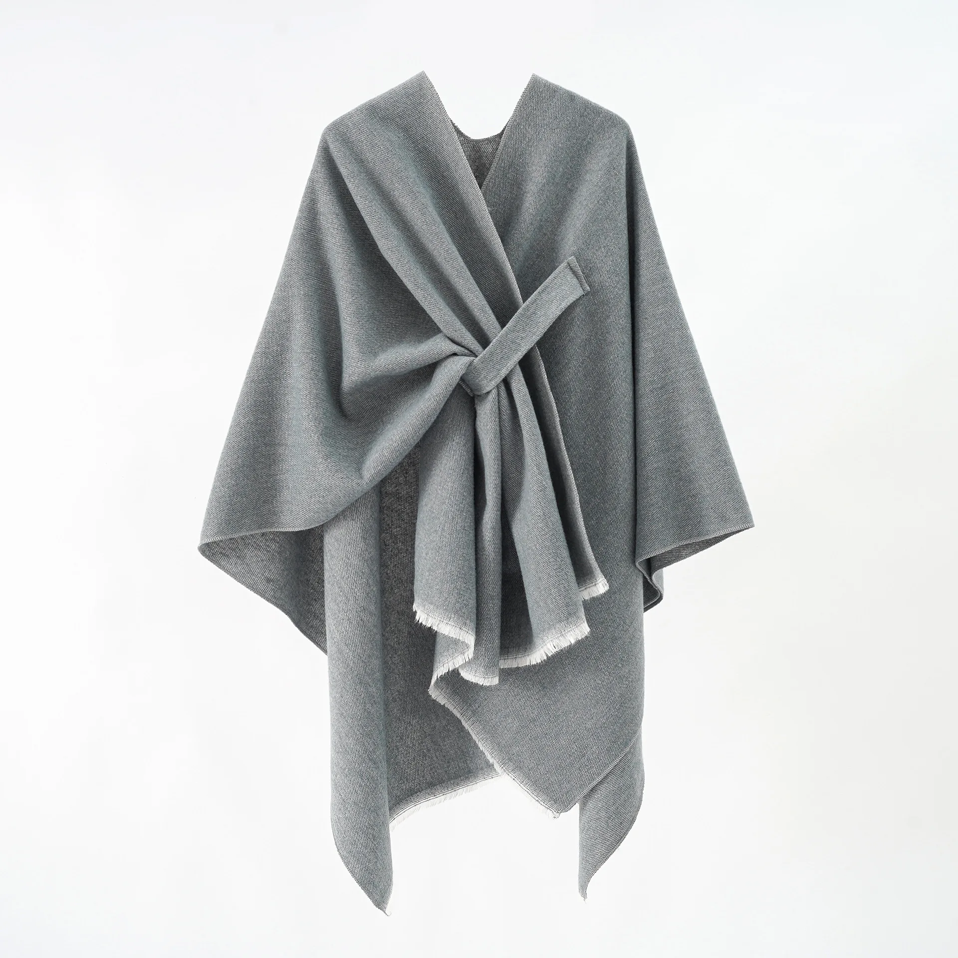 A woman\'s plain-colored shawl with stripes and a split imitation cashmere shawl cape