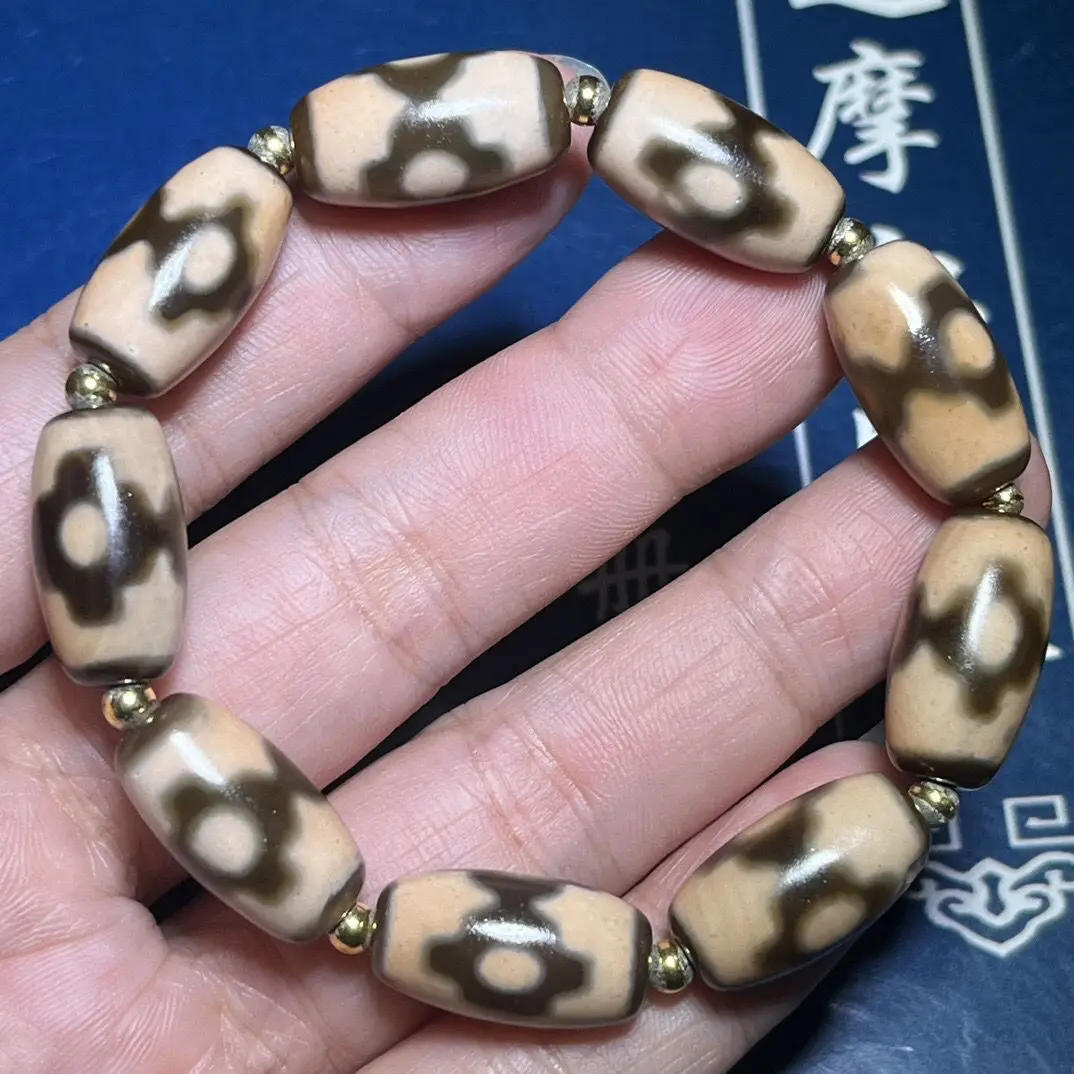 Tibetan high-oil pulp three-eye dzi bead bracelet [currency] Size: 19 * 10mm * 9 pieces