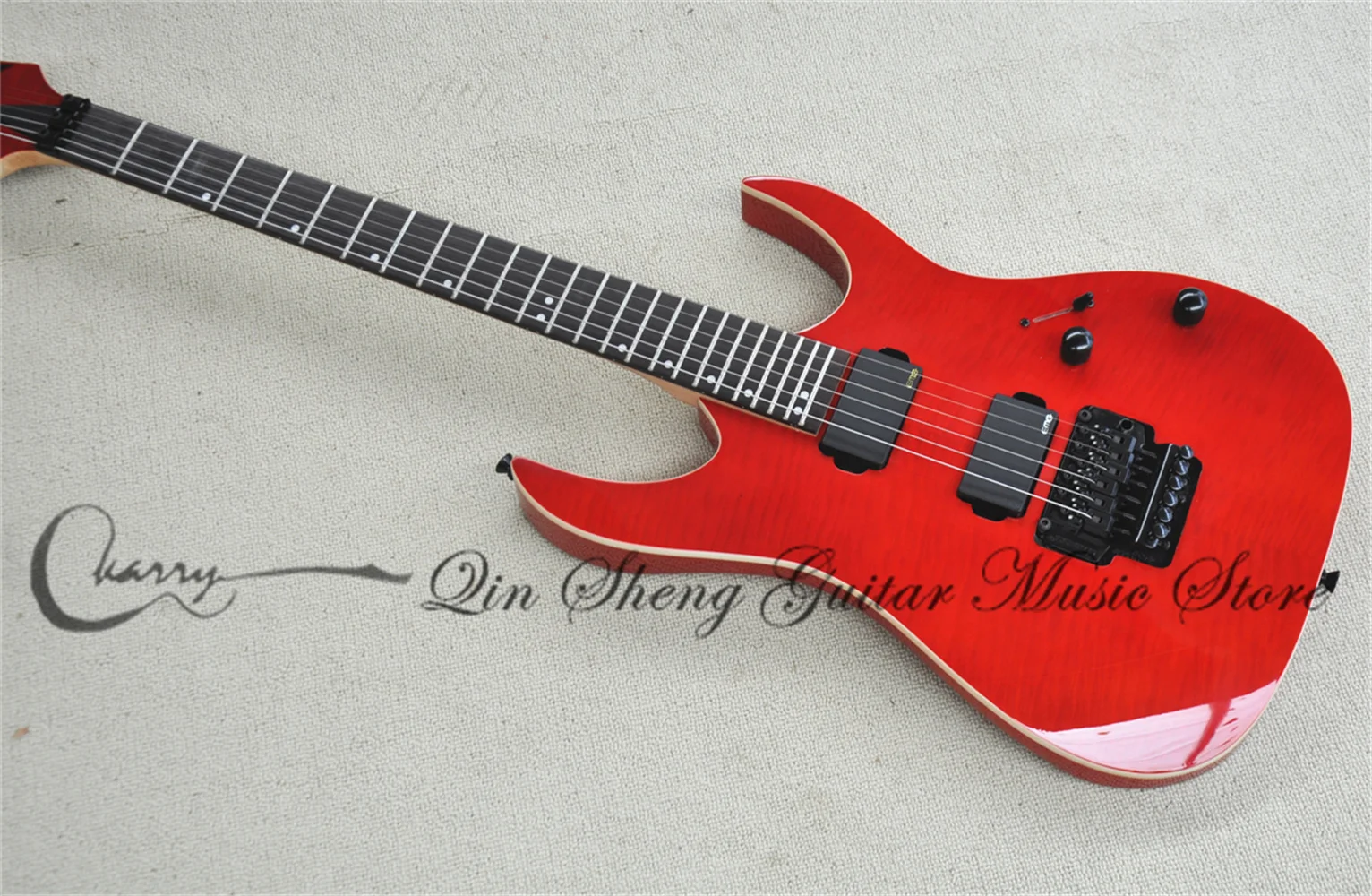 Red electric guitar, Flame maple top, white binding, tremolo bridge, rosewood fingerboard, maple neck, black hardware