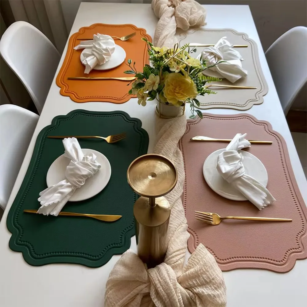 

4 Piece Elegant Retro Irregular Tableware Pad PU Leather Waterproof Table Mat Scratch Resistant Non-slip Place Mat Wedding