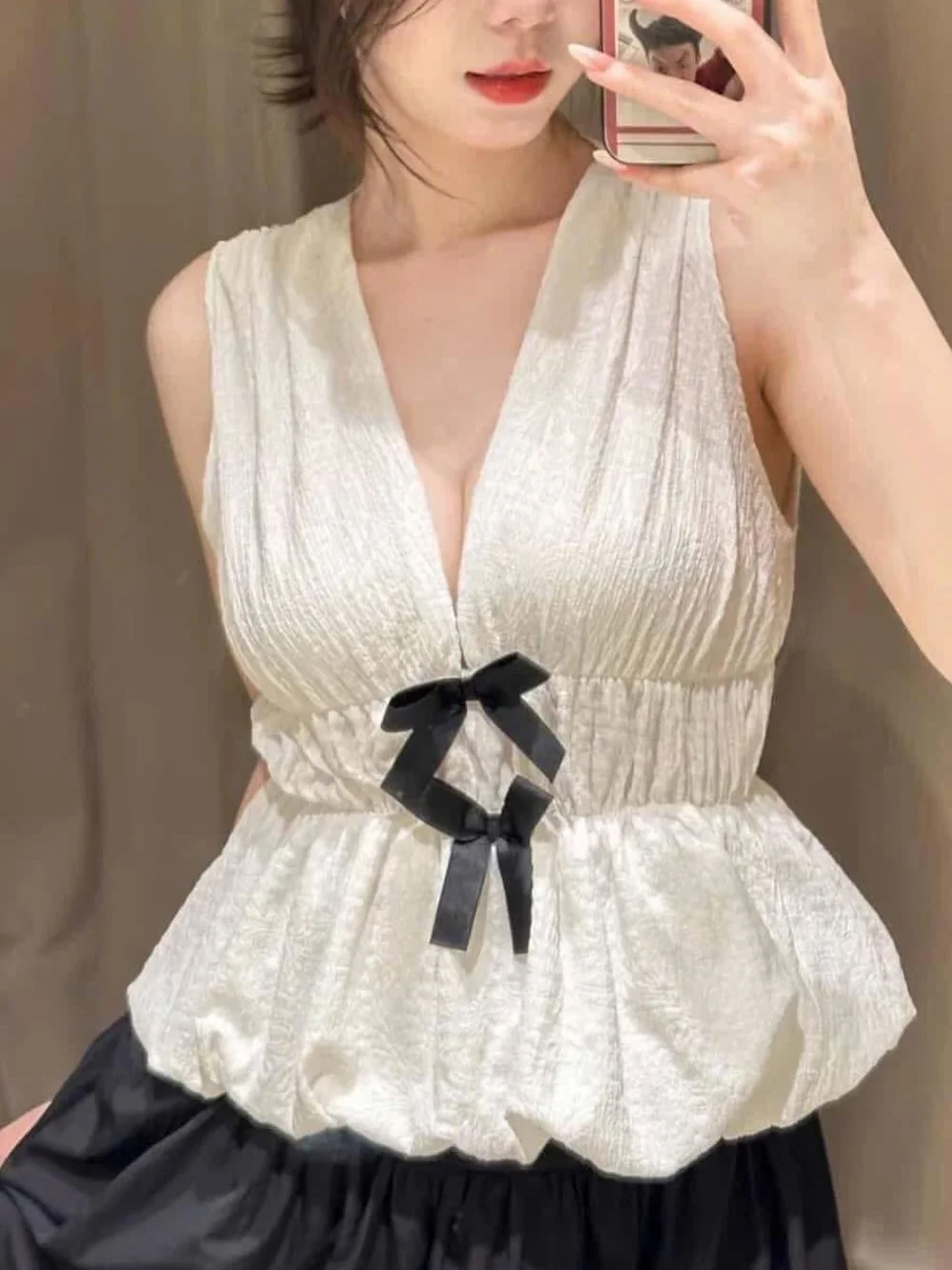 Autunno da donna nuovo semplice scollo a V profondo bordo con fiocco strutturato casual top slim pendolarismo elegante top corto senza maniche in vita elastica