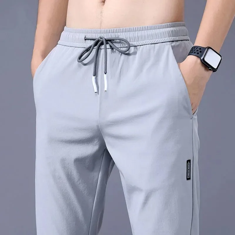 

Men's solid color pants, summer ice silk elastic quick drying loose sports pants, suitable for casual and business wear