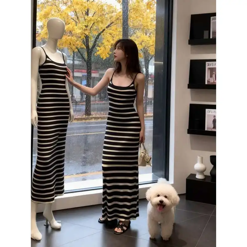 Korean striped suspender dress women's 2026 spring and summer new design sense slim and thin versatile long dress holiday style