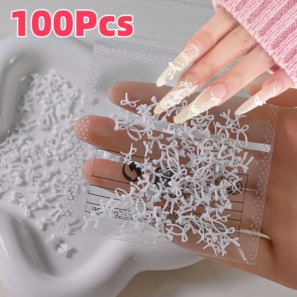 ชาร์มตกแต่งเล็บรูปโบว์สีขาวสไตล์มินิมอล 3 มิติ จำนวน 100 ชิ้น โบว์ริบบิ้นมินิแบบคละแบบสำหรับตกแต่งเล็บ DIY งานฝีมือ ชิ้นส่วนสำหรับทำเล็บ