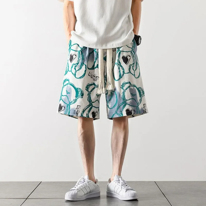 Pantalones cortos de playa de seda fina para hombre, cintura elástica, bolsillo, estampado de dibujos animados, Graffiti, moda informal, versátil, suelto, nuevo, Verano