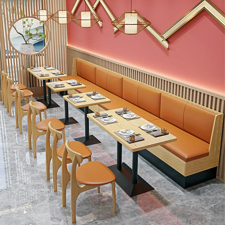 Combination of Solid Wood Orange Chairs Tables and Chairs Against the Wall in Restaurants and Fast Food Restaurants