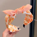 6  orange bow flower