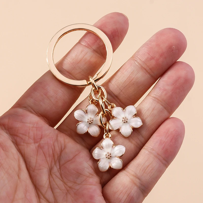 Aihua 40 Farben Niedlicher Pflanzen-Schlüsselanhänger Emaille Sakura-Blumen-Schlüsselanhänger für Frauen Mädchen Handtasche Anhänger Autoschlüsselhalter DIY Schmuck Geschenke – Detail 6