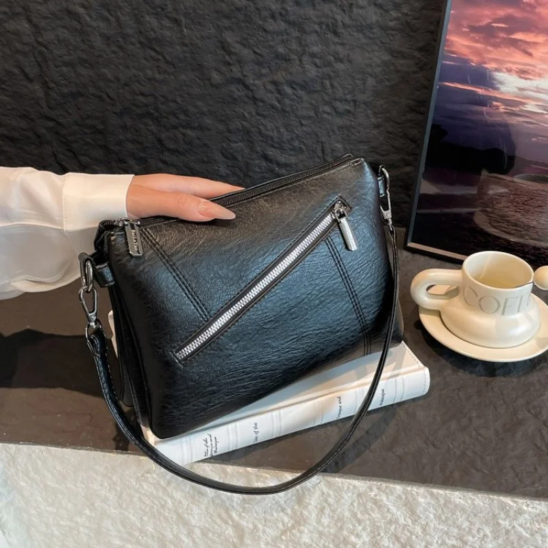 

2025 Новая высококачественная женская кожаная сумка Роскошный бренд Известный дизайнер Простой Париж Элегантный ​