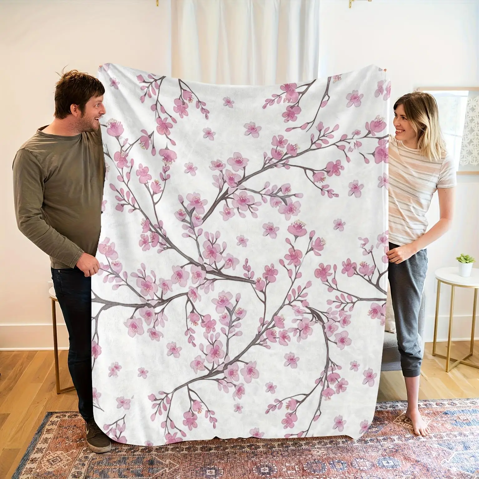Elegant cherry blossom pattern blanket, made of polyester, machine washable, suitable for bedroom and living room décor.