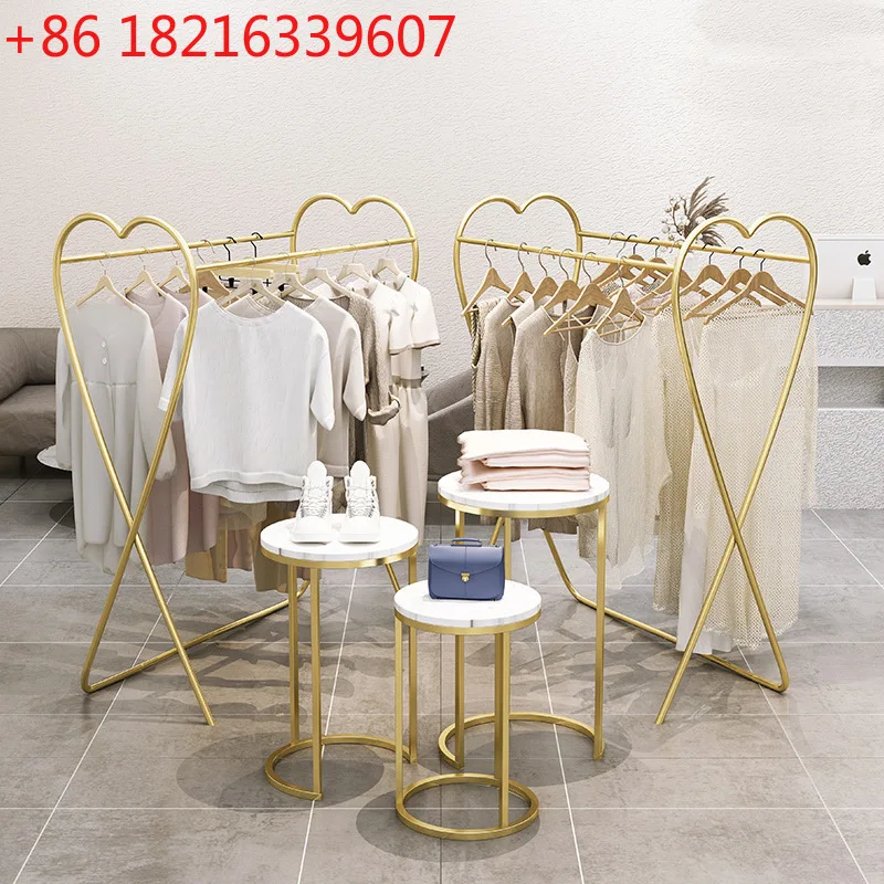 Table placed in the middle of the water table, simple women's clothing display rack, window cabinet