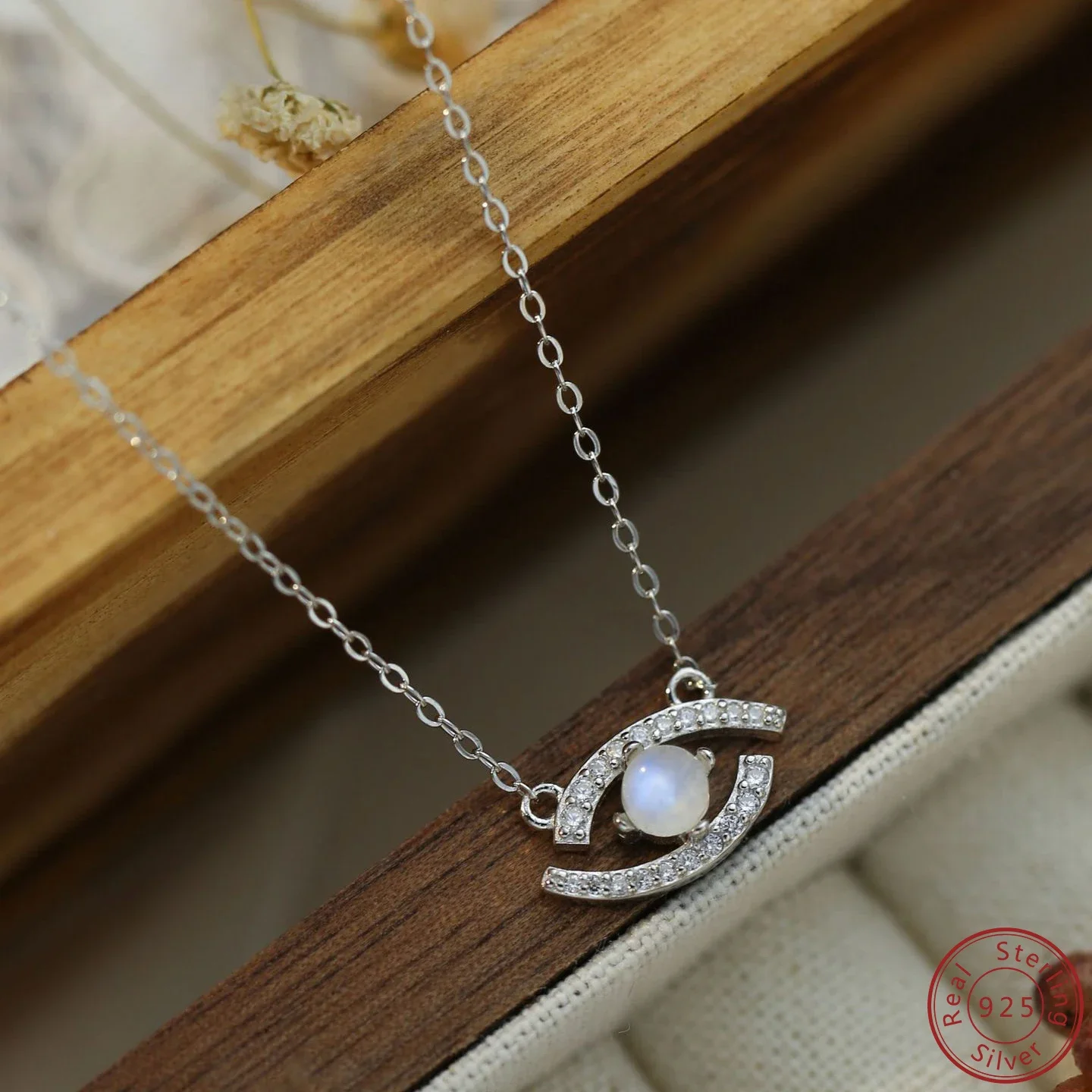 

925 sterling silver zircon and moonstone eye shaped women's necklace in a fashionable style suitable for gatherings or as a gift