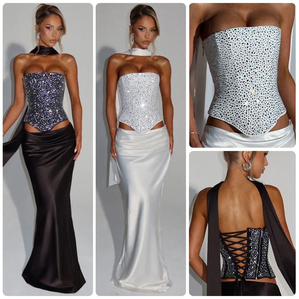 

Новинка 2026: Женский осенний комплект в стиле Pure Desire — топ-бюстье со стразами, атласный, с лентами, и длинная юбка-рыбка.