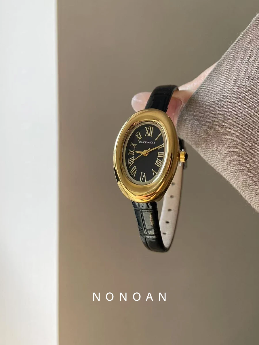 

Elegant women's watch, oval dial, luxurious retro quartz leather strap, fashionable and sophisticated women's accessory.