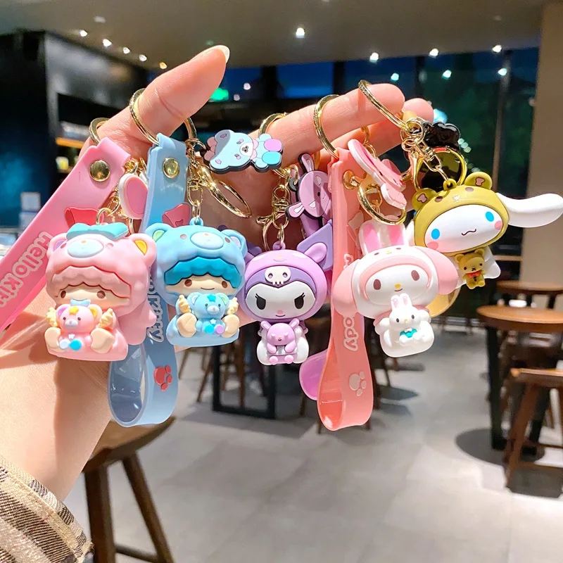 

Sanrio Costume Keychains — Cute Kuromi, My Melody, Cinnamoroll, and Little Twin Stars, 3D Adorable Figurine Keychains, with Silicone Wrist Straps, High-Quality Backpack Charms, Bag Accessories, Perfect as Gifts