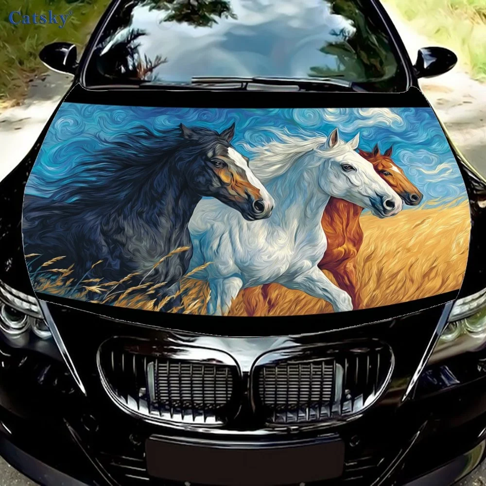 Vibrant car hood cover featuring three galloping horses in a field, set against a swirling blue sky backdrop. Perfect for nature
