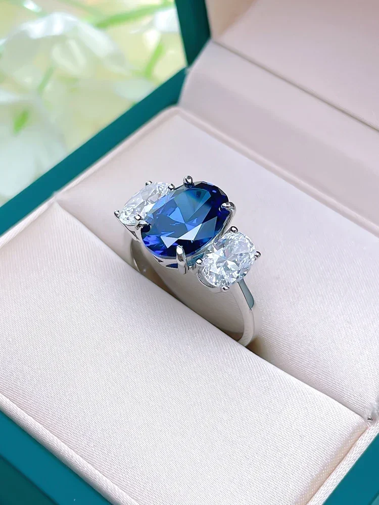 Wholesale of Light Luxury Chinese Made Treasure Blue Three Stone 925 Silver Ring Inlaid with High Carbon Diamond Wedding Jewelry