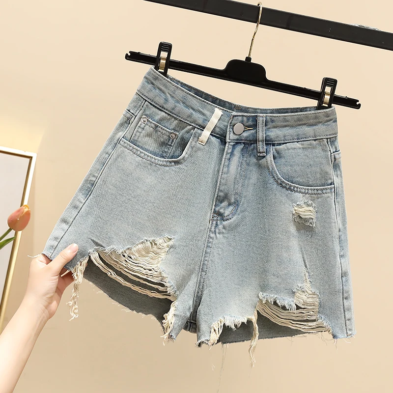 

Модные джинсовые шорты с рваными дырками для женщин, лето 2025 г., широкие брюки с высокой талией, универсальные прямые шорты с необработанными краями