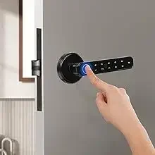 Black electronic door lock with digital keypad being operated by a hand pressing a fingerprint sensor or button.
