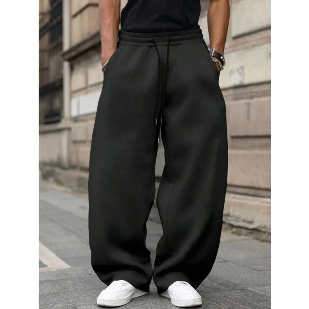 

Men's loose wide-leg pants solid color drawstring casual style long sports pants for autumn and winter wear. men clothing