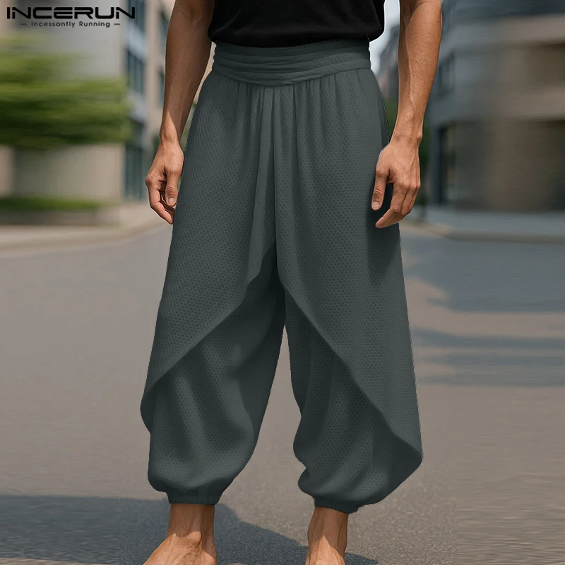 

INCERUN Men Pants Solid Color Joggers Elastic Waist Loose Casual Trousers Men Streetwear 2025 Fashion Irregular Long Pants S-5XL