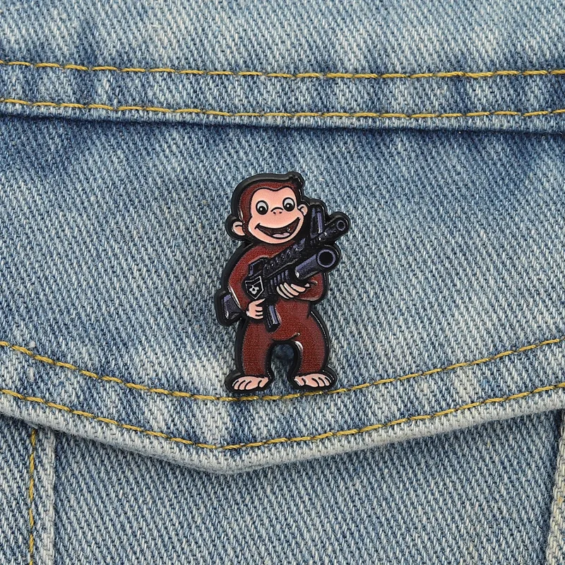 

Cartoon cute monkey shaped metal gun Enamel Pins Fashionable fun animal Brooches Lapel Badges Jewelry Gifts