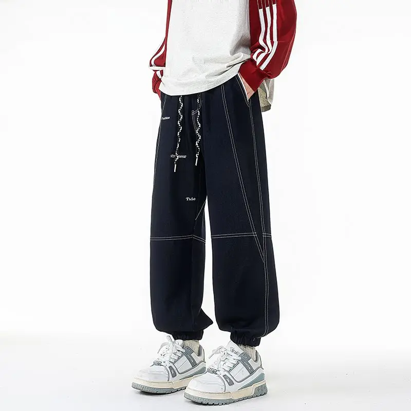 Pantaloni da uomo stile retrò taglie forti versatili per la primavera e l'autunno pantaloni allacciati alla caviglia pantaloni da lavoro casual larghi e dimagranti
