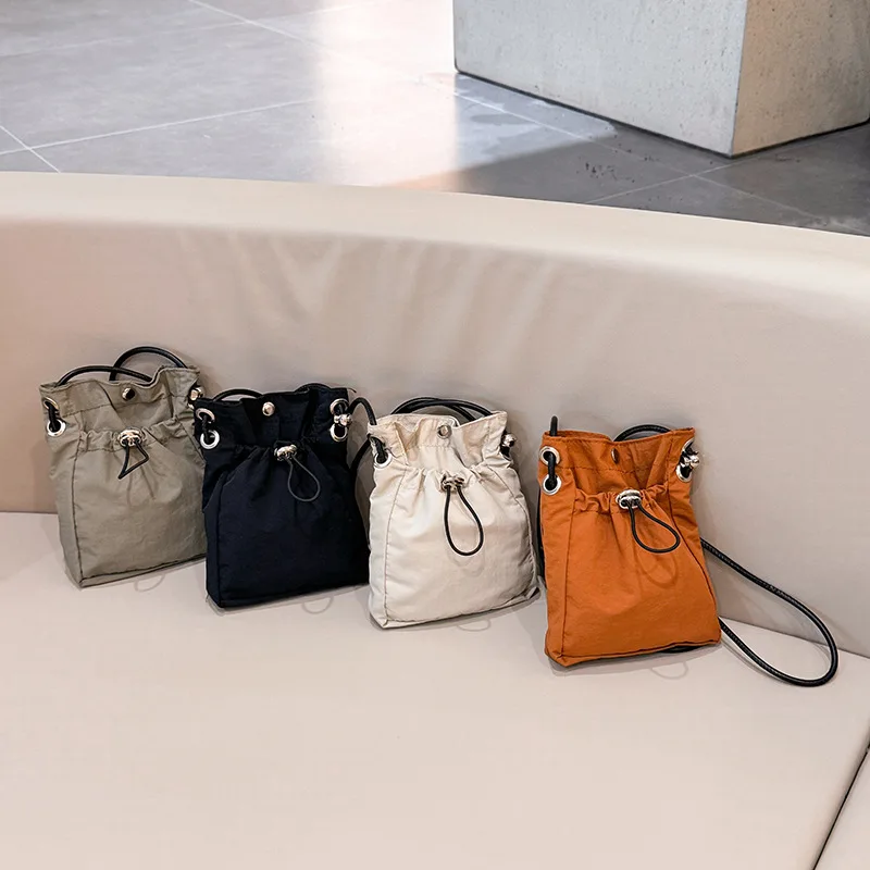 

Korean Mini Nylon Crossbody Shoulder Bag Bucket Style Drawstring Small Handbag Casual Purse for Men And Women with Phone Pouch