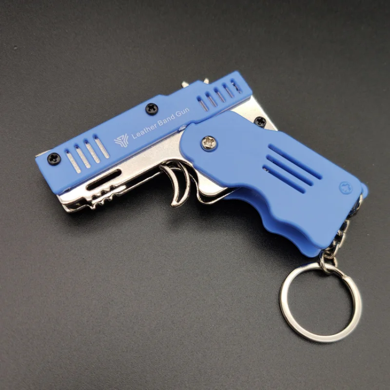 Mini pistola de goma completamente de Metal, se puede plegar como un llavero, juguete de regalo para niños, seis ráfagas de pistola de juguete de goma