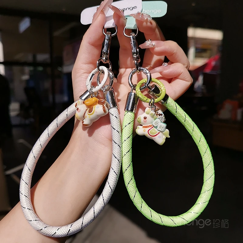 

Anti-Loss Phone Wrist Strap with Pony Charm｜Mesh Woven Design｜Universal Fit for All Smartphones
