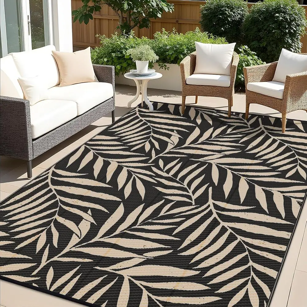 

Reversible 8x10 Outdoor Plastic Rug with Leaf Pattern, Suitable for RV, Patio, and Camping in Black & Beige