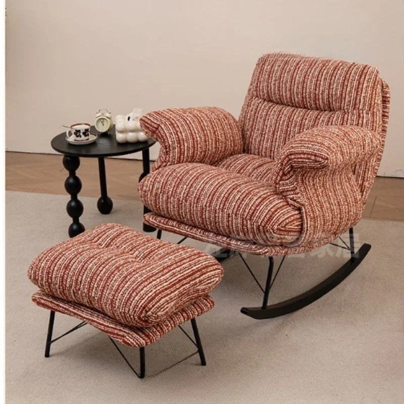 

Rocking recliner, antique reclining and sleeping rocking chair on the balcony