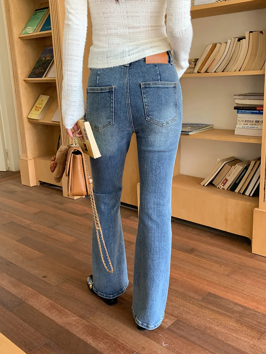 Jeans slim fit pinggang tinggi biru baru di awal musim gugur dengan efek pull up sedikit