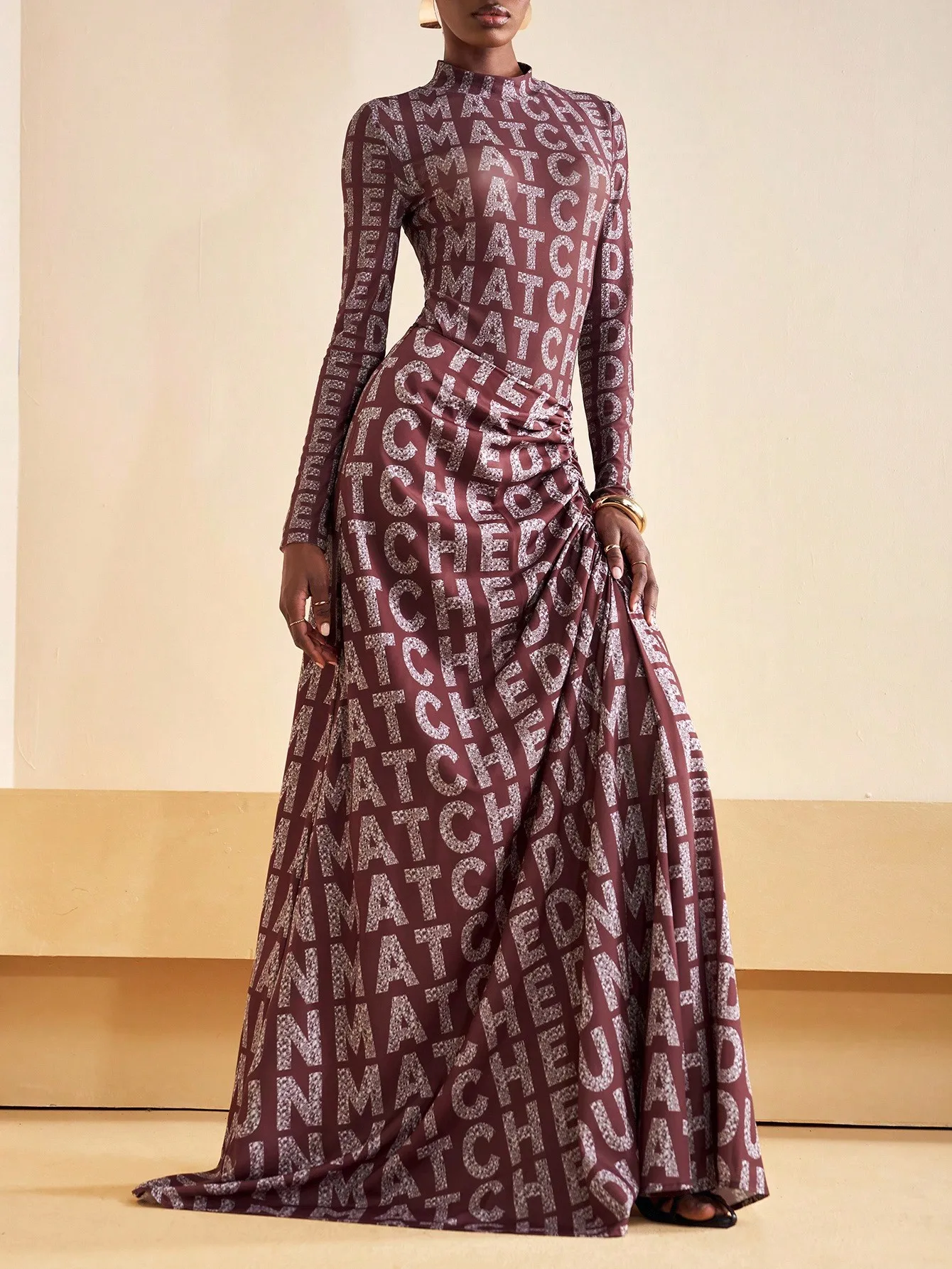 

Elegant Long Sleeve Mock Neck Maxi Dress with Metallic Letter Print & Ruched Waist