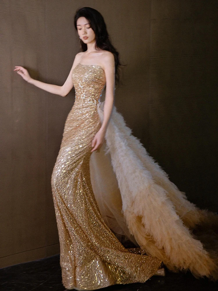 

Ele Gold Beaded Bridal Gown with Fi Tail Design And Strapl Top for Wedding Engagement Parties And Performances