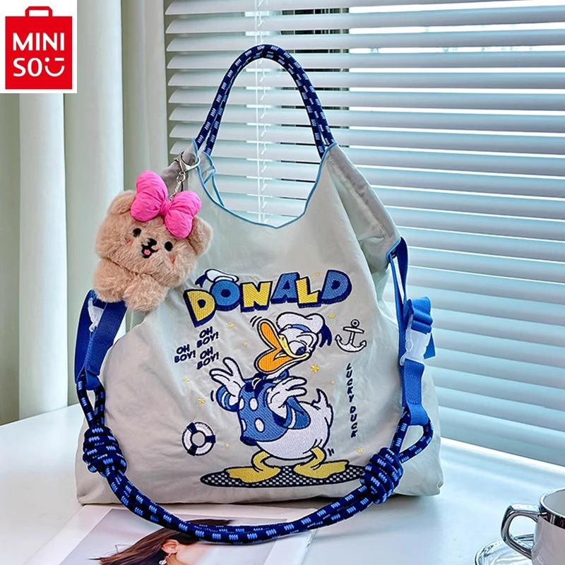 

MINISO 2024 Fashion New Embroidered Donald Duck Three Eyed Cute Cartoon Handbag for Women, Large Capacity Storage Bag