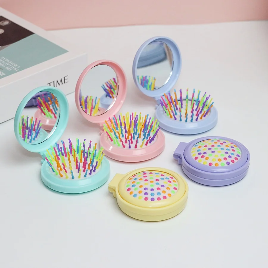 

Candy colored folding comb, portable makeup mirror, airbag comb, anti-static massage rainbow comb, integrated mirror comb