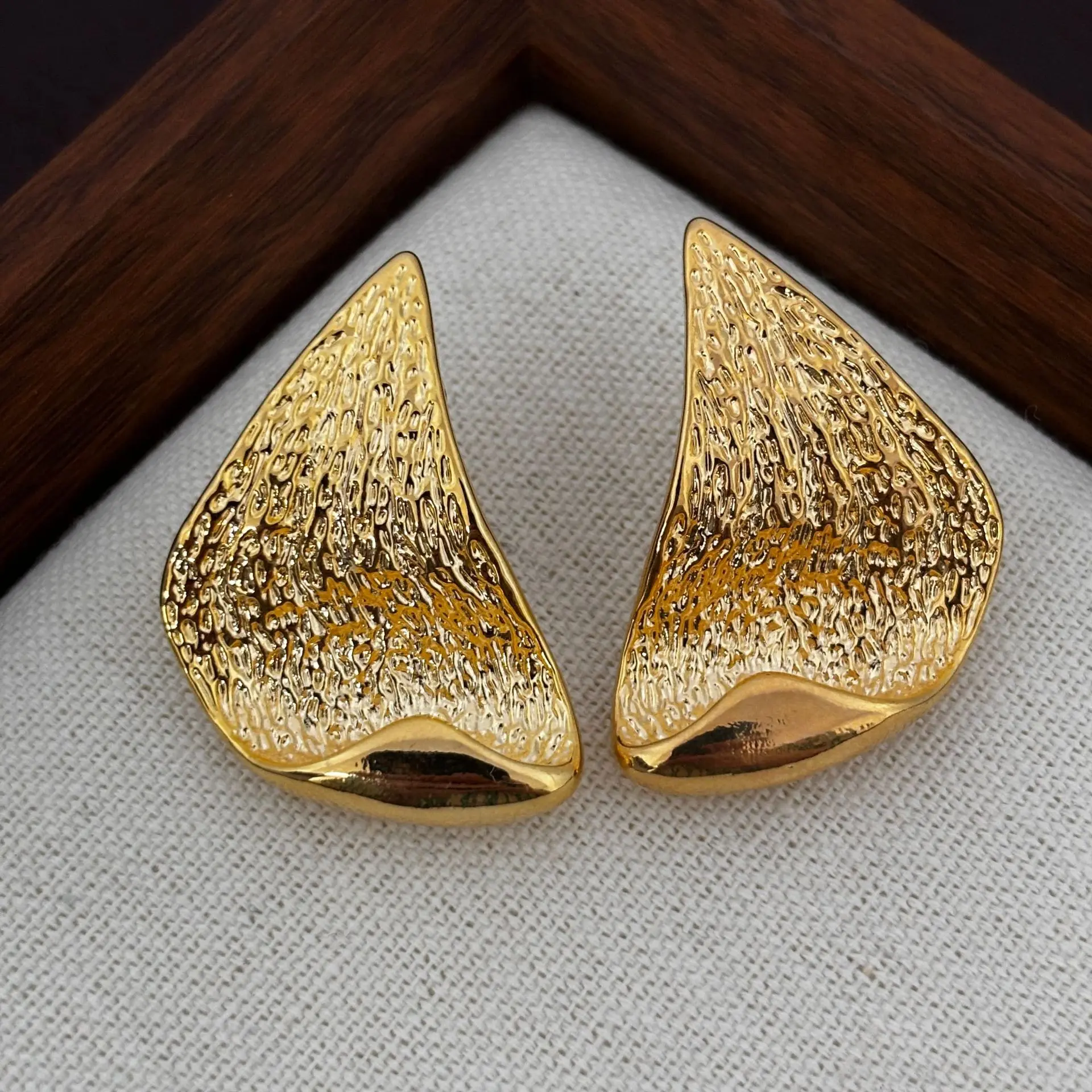 Retro texture irregular triangular stud earrings women's concave-convex lava earrings gold and silver two-color earrings