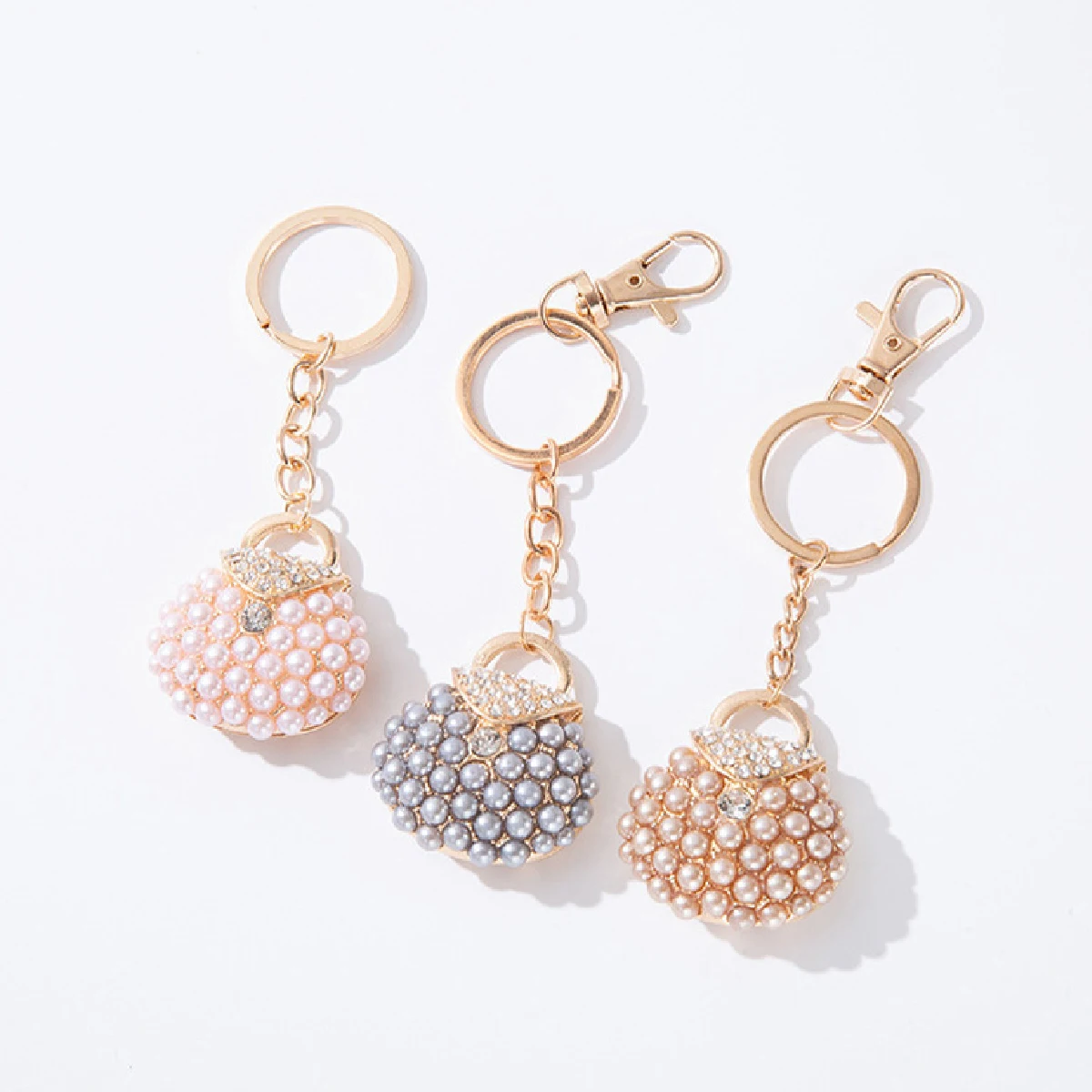 Porte-clés de sac en perles de diamant, pendentif en métal, accessoires de voiture, mignon, chaud, nouveau, 1 pièce