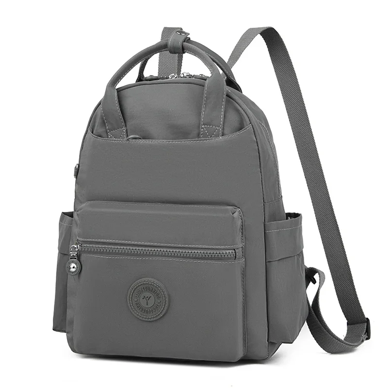 حقيبة ظهر كاجوال بسيطة للطلاب من Mochila ذات سعة كبيرة وجيوب متعددة مع حقيبة ظهر مناسبة للمدرسة الثانوية وحقائب الظهر للتنقل اليومي