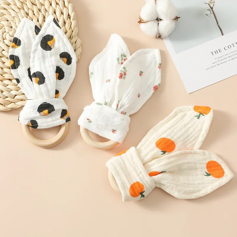 

Cute Cotton Rabbit Ears Baby Teether Newborn Wooden Teething Ring Hand Grasp Toy Safe Organic Wood Bracelet Rattle Sensory Toy