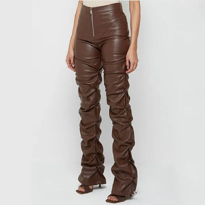Stylish, tight-fitting PU leather trousers with a unique flared design and pleats.
